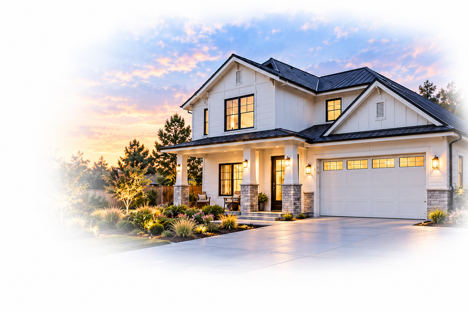 White modern farmhouse with a dark gabled roof, a welcoming front porch, and warmly lit windows at dusk